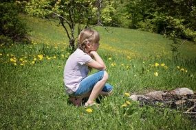 child on the flower field