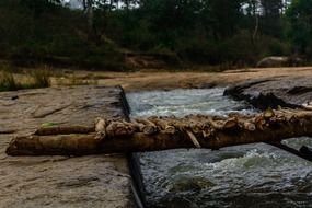 wooden bridge over mountain river