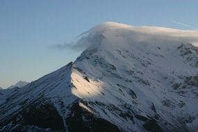 clouds at snowy mountain
