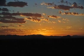 sunrise on an orange sky over the horizon