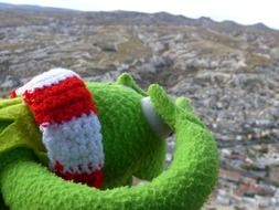 plush toy frog on the mountain