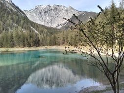 green lake near the mountains