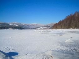 frozen lake near the mountains