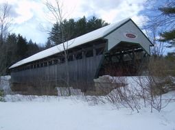 covered bridge in winter day