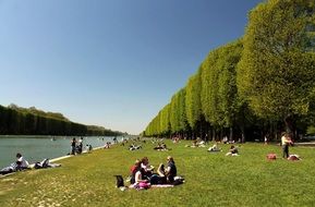 people on a lawn in a park in Versailles