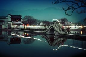 ancient building by the river in china at night