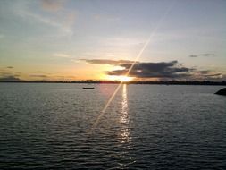 sunset on the background of a boat on the sea