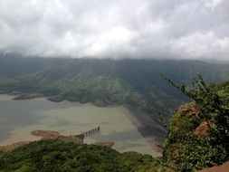 aerial view of a hydroelectric power station on a lake