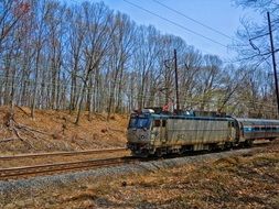 old train on the tracks on a sunny day