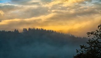 fog in mountains at sunset