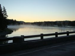 Sunrise over the lake in the fog