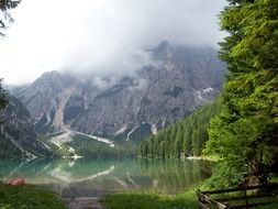 Landscape with the lake near the mountains in spring