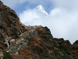 travelers in steep mountains