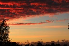 Beautiful landscape in colorful sunset with red clouds