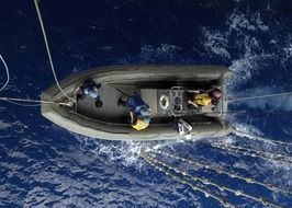 top view of people on military raft on the water