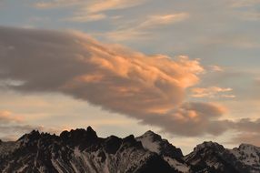 mountain peaks under thick clouds