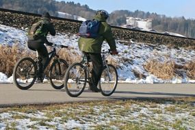 two people on a mountain bike path