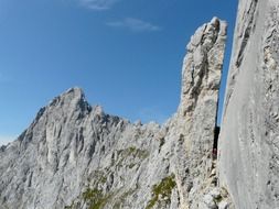 pointed rocks on the background of bright sky