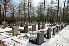 gravestones on cemetery at winter, Germany