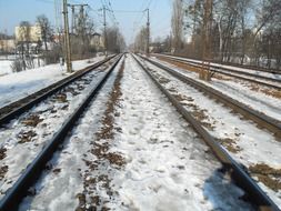 railway tracks amid snow in poland