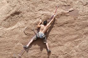 sports man climbing a mountain
