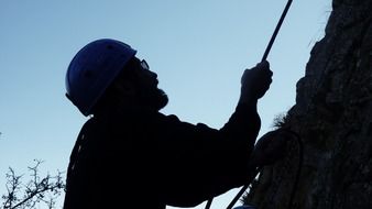 silhouette of a male climber in the mountains