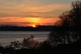 landscape of elbe lake at the orange sunset in winter