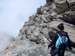 Girl climbing on a mountain