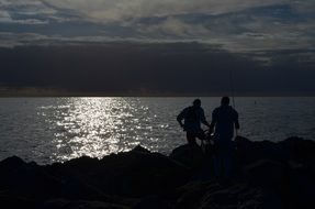 fishermen on the lake at sunrise