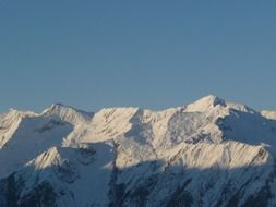 landscape of snowy mountains at morning sunlight