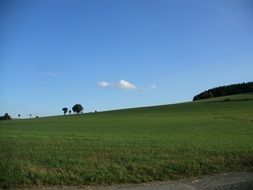 wide sky meadow field trees blue