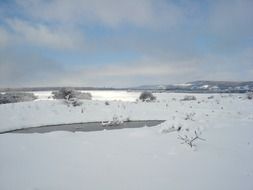 cloudy sky over a snowy valley