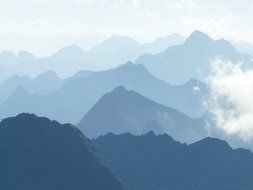 blue mountain summits in mist, spain, pico aneto