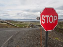 Stop sign on the side of the road