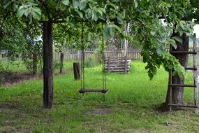 wooden swing in the garden