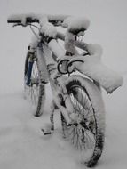 the bike is covered with snow