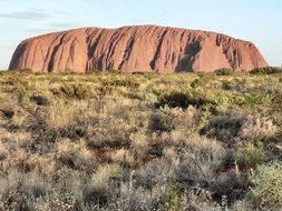 Ayers Rock is a large sandstone rock formation in the southern part of the Northern Territory in central Australia