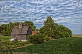 distant view of a wooden barn in a field in Missouri