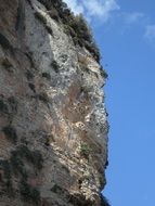 Close-up of the steep cliff at blue sky background in Mallorca