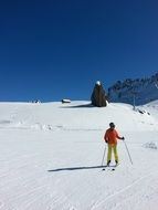 skier on a mountainside in winter