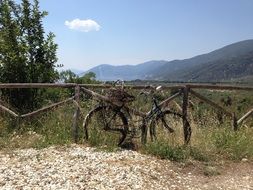 bicycle rusty fence