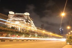 fullerton hotel in traffic lights at night