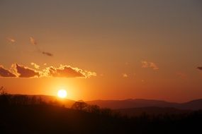 Beautiful and colorful sunset on horizon in summer time