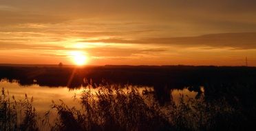 sun in the orange sky during sunset