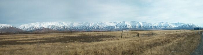 a distant view of the snow-capped mountains in New Zealand