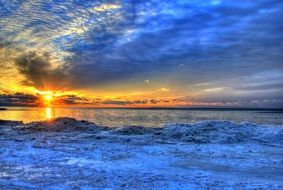 winter landscape of Lake Michigan in the background of a beautiful sunset