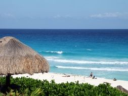 Beautiful white sand beach with rocks at blue sea, mexico,cancun