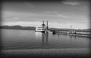 Black and white photo of a boat on a lake