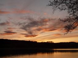 a picturesque landscape on the lake at sunset