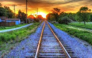 burning sky at sunset on the horizon of the railway